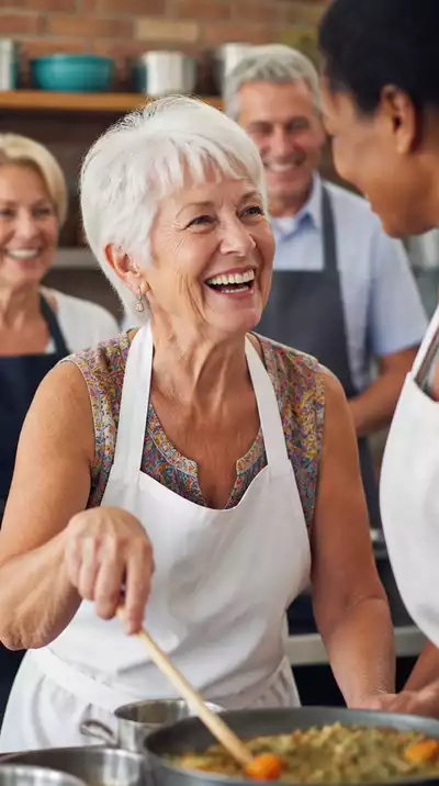 Senior woman enjoying a cooking class with other travelers, showing social engagement